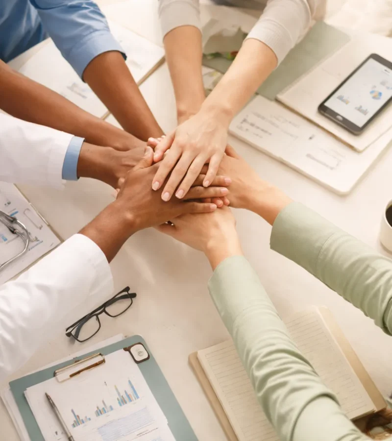 medical-team-hands-stack